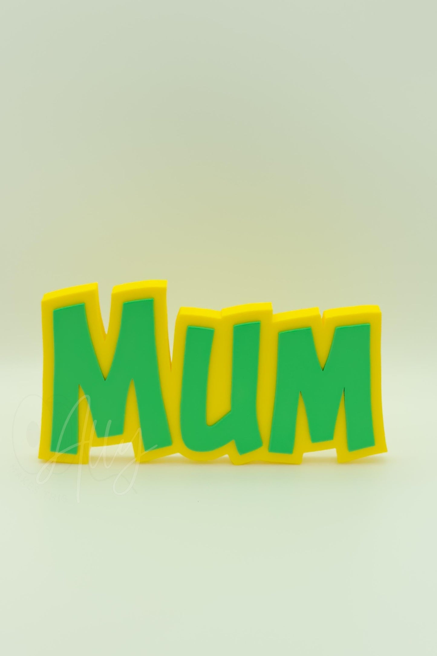 3D printed MUM nameplate with a vibrant yellow base and green lettering. Freestanding and customisable, perfect for a personalised Mothers Day gift, shelf decor, or a thoughtful keepsake.